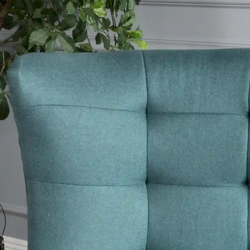 Poltrona singola in tessuto con bottoni a capitonné, schienale alto e ali laterali, nei colori grigio, verde acqua e grano