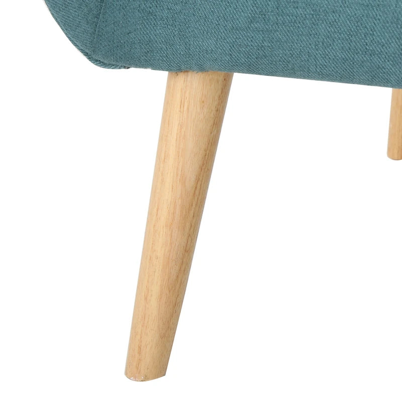 Poltrona singola in tessuto con bottoni a capitonné, schienale alto e ali laterali, nei colori grigio, verde acqua e grano
